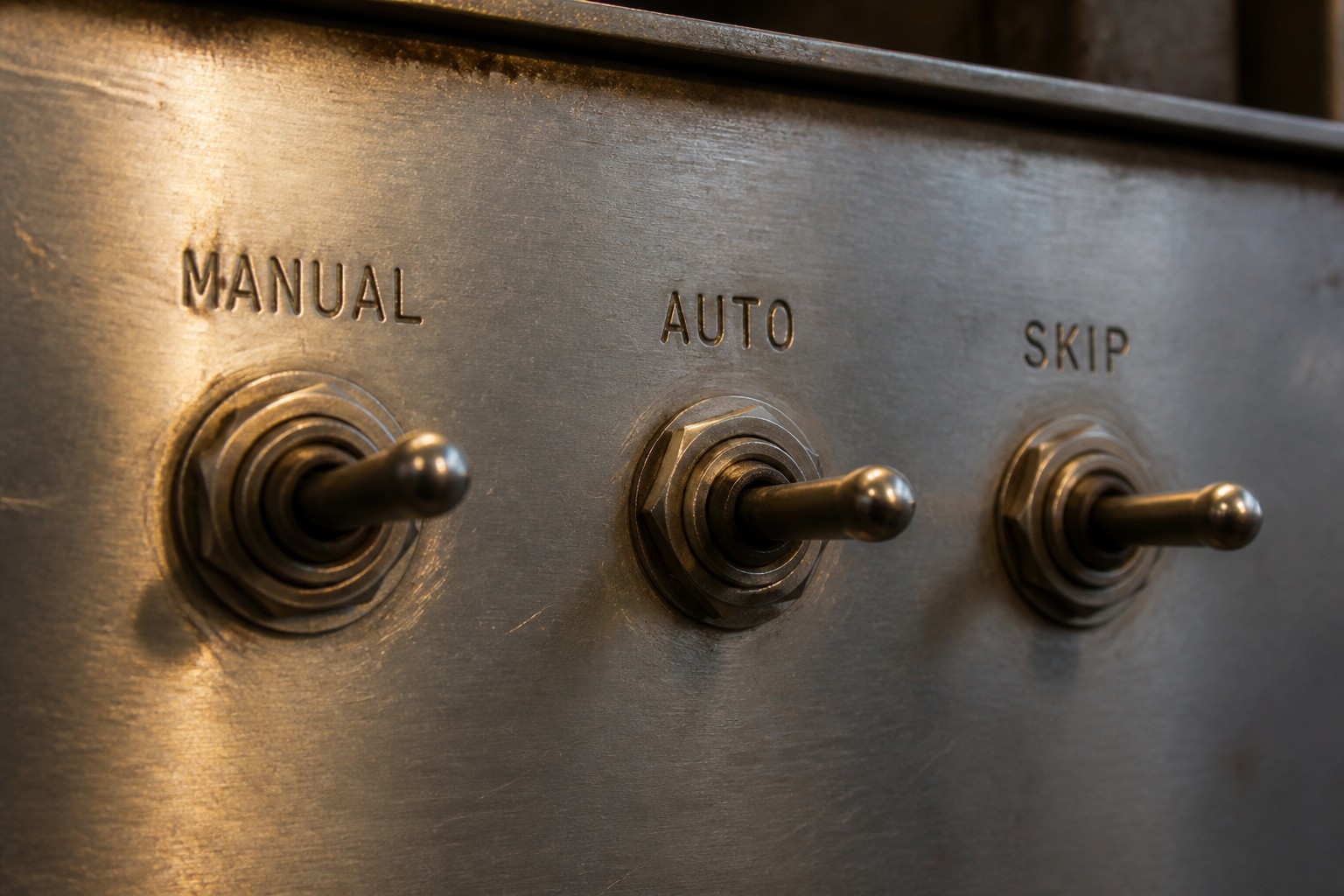 Three metal toggle switches labeled Manual, Auto, and Skip, standing in for Claude in Chrome permission modes.