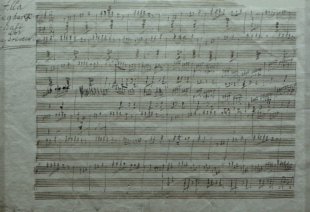 Courthouse papers next to sheet music and a balance scale, no people or brand logos