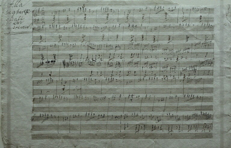 Courthouse papers next to sheet music and a balance scale, no people or brand logos
