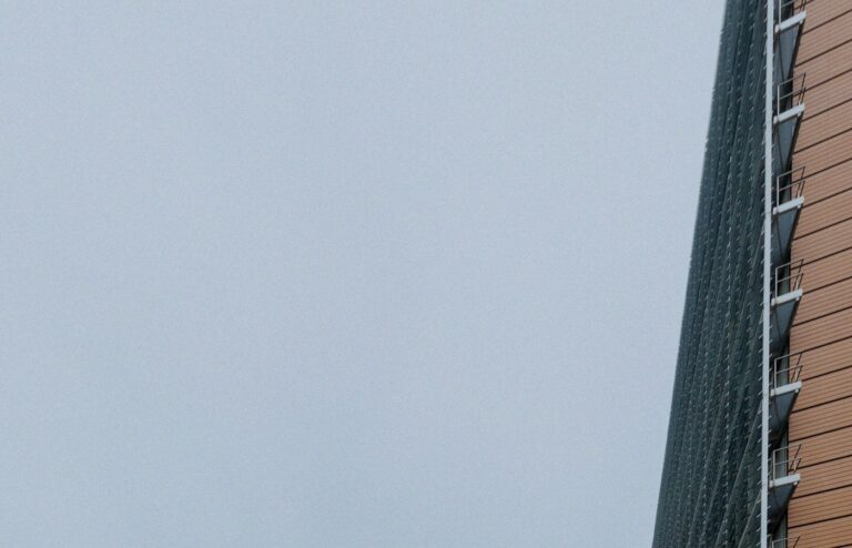 Corner of the Berlaymont building in Brussels against overcast sky, no people or brand logos