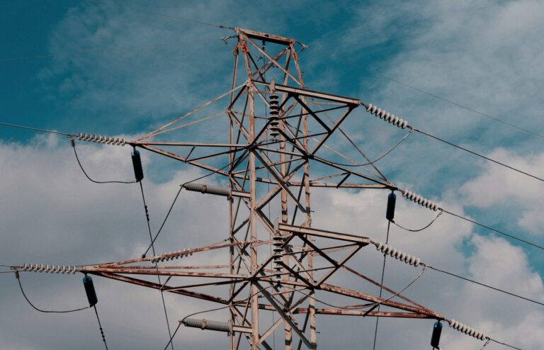 Face-free high-voltage transmission tower for AI Energy Management Alliance — electrical infrastructure, Sep 16 2026