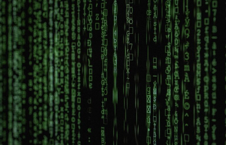 Face-free green digital code cascade on black screen — related still for Aslan $20.8M seed national-security AI undercover agent coverage