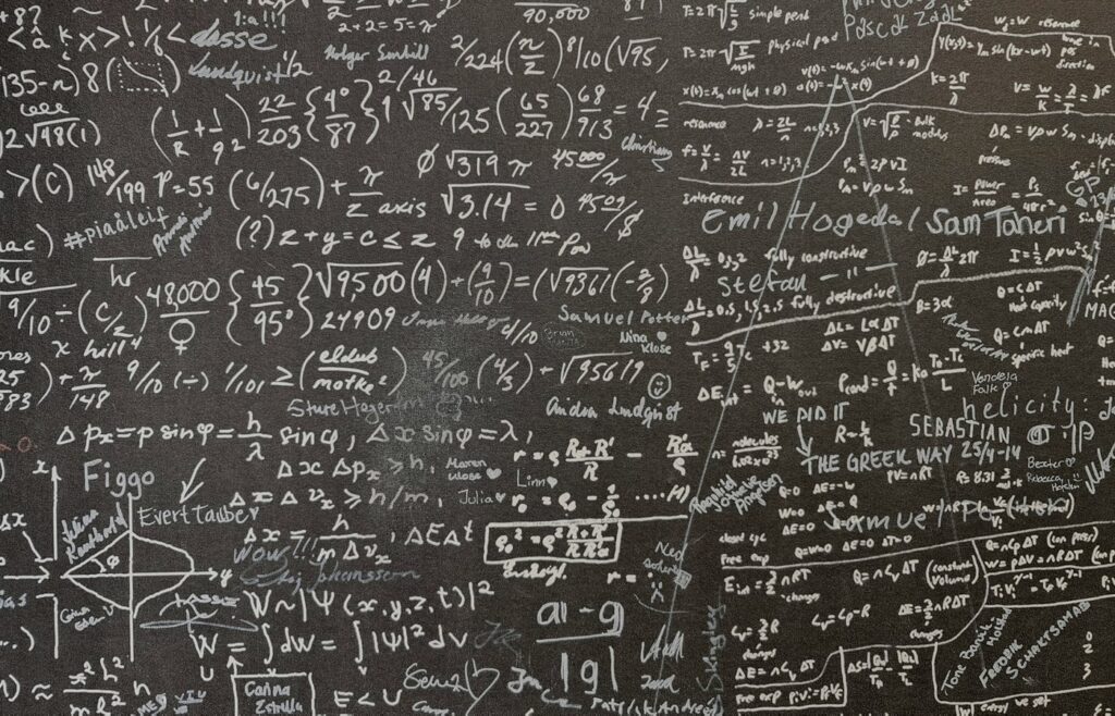 Face-free Unsplash chalkboard densely covered with chalk math equations — hero still for 25 Fields Medallists AI mathematics misalignment declaration September 2026