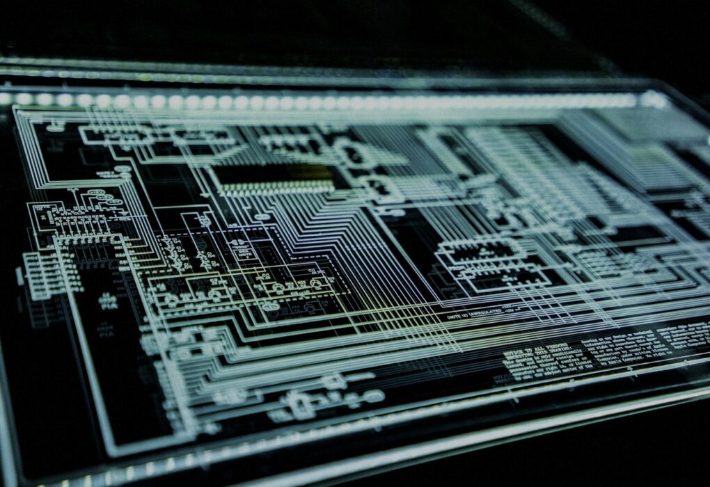 Face-free abstract teal LED circuit panel glowing against a dark background — related cybersecurity and agent supply-chain infrastructure still for AIR AI security startup coverage