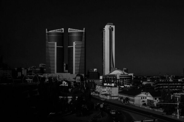 Face-free twin-city skyline for Cohere × Aleph Alpha — definitive enterprise combine, Sep 16 2026