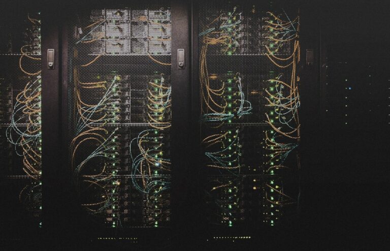Face-free Unsplash photograph of data-center server racks with network cabling — related still for Cornelis Networks $205M Active Compute Fabric September 2026