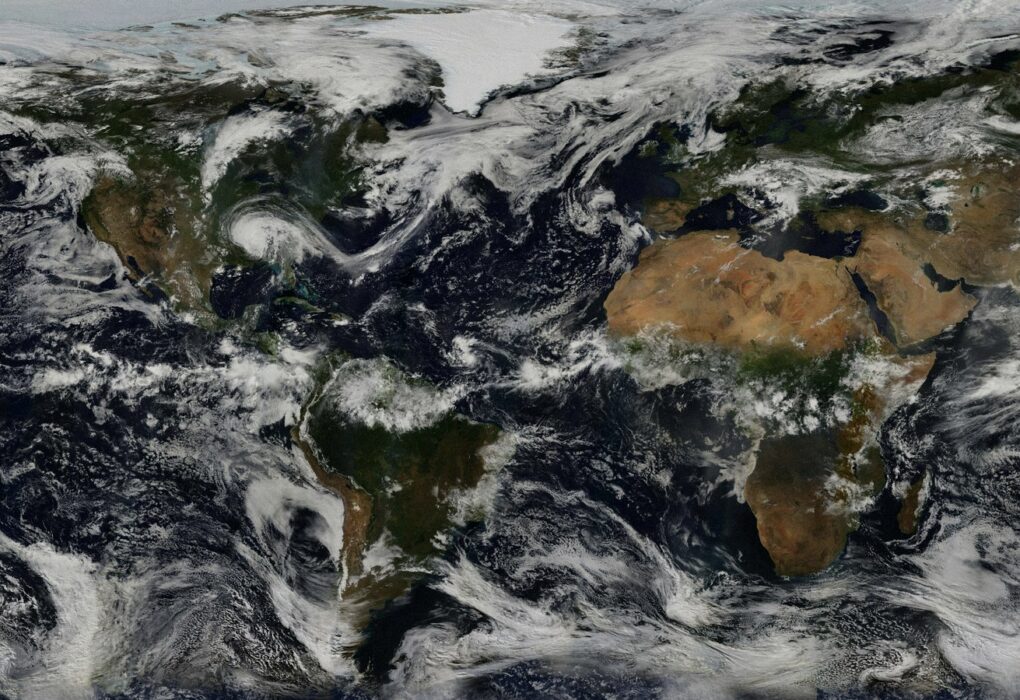 Face-free NASA Earth continents and oceans with clouds still — related globe still for UN High Commissioner Volker Türk Human Rights Council AI international red lines coverage