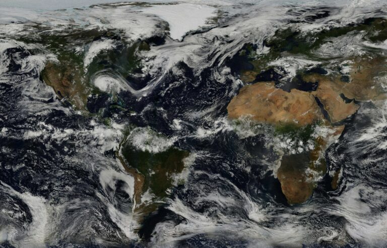 Face-free NASA Earth continents and oceans with clouds still — related globe still for UN High Commissioner Volker Türk Human Rights Council AI international red lines coverage