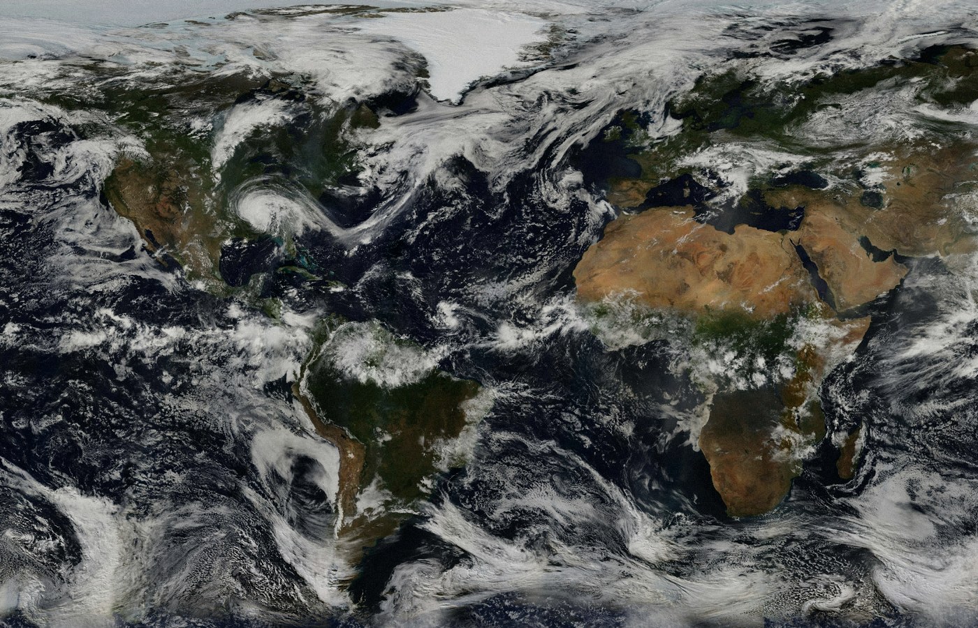 Face-free NASA Earth continents and oceans with clouds still — related globe still for UN High Commissioner Volker Türk Human Rights Council AI international red lines coverage