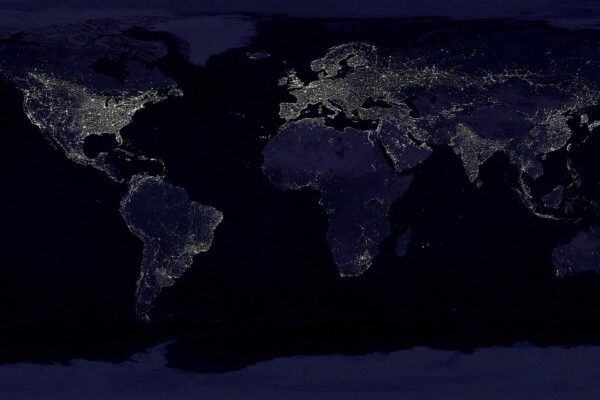 Face-free public-domain NASA Earth city-lights composite at night — global network / internet metaphor hero still for Amodei pace-the-frontier essay September 2026