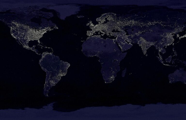 Face-free public-domain NASA Earth city-lights composite at night — global network / internet metaphor hero still for Amodei pace-the-frontier essay September 2026