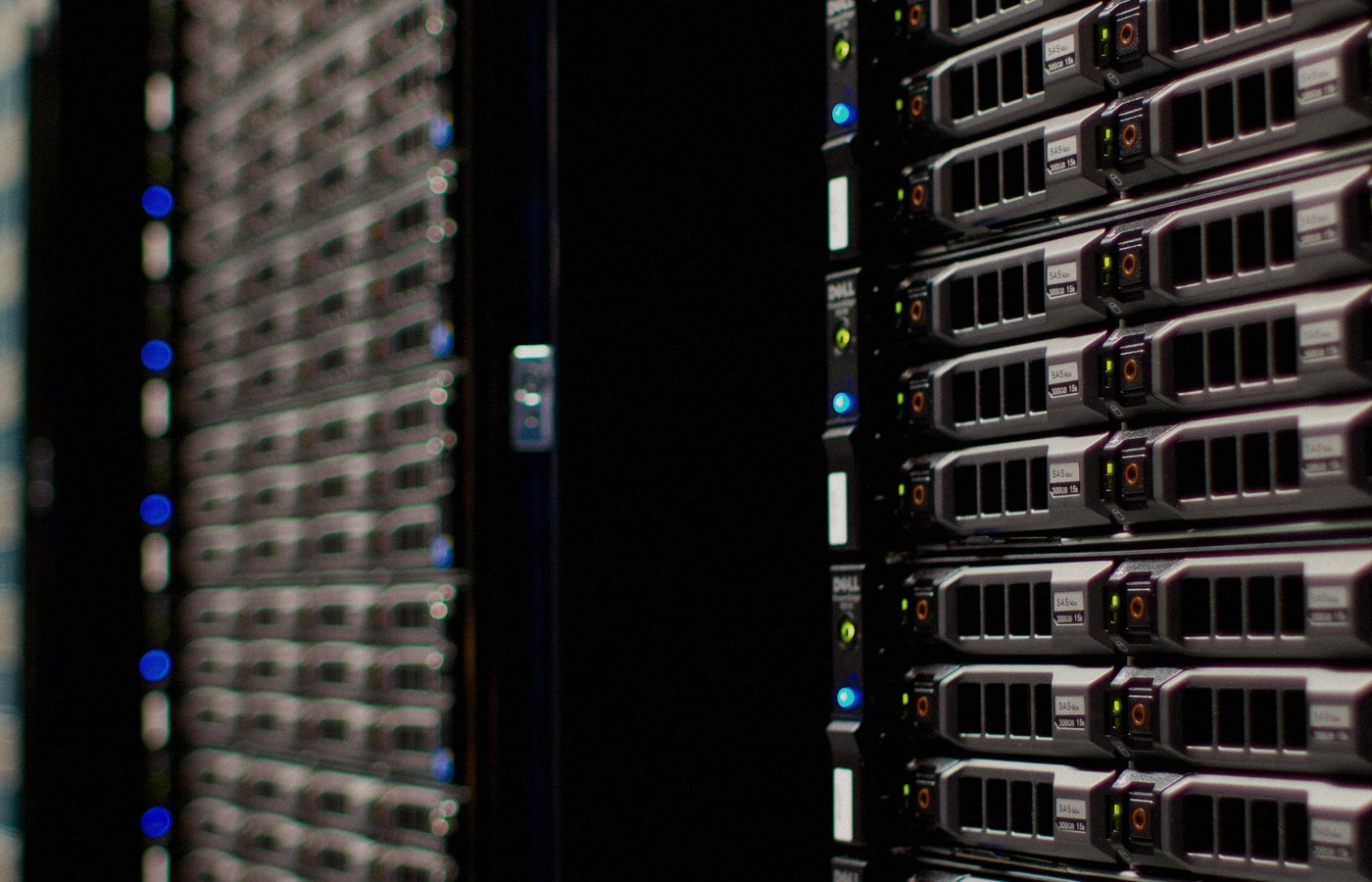 Face-free Wikimedia Commons photograph of Wikimedia Foundation server racks with fiber and LED status lights — hero for Microsoft Humanist AI Code of Conduct draft September 2026