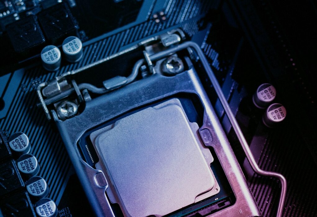 Face-free close-up of a CPU seated on a computer motherboard — related still for Jakub Pachocki An Alien Mind shared safety bars and voluntary slowdown coverage