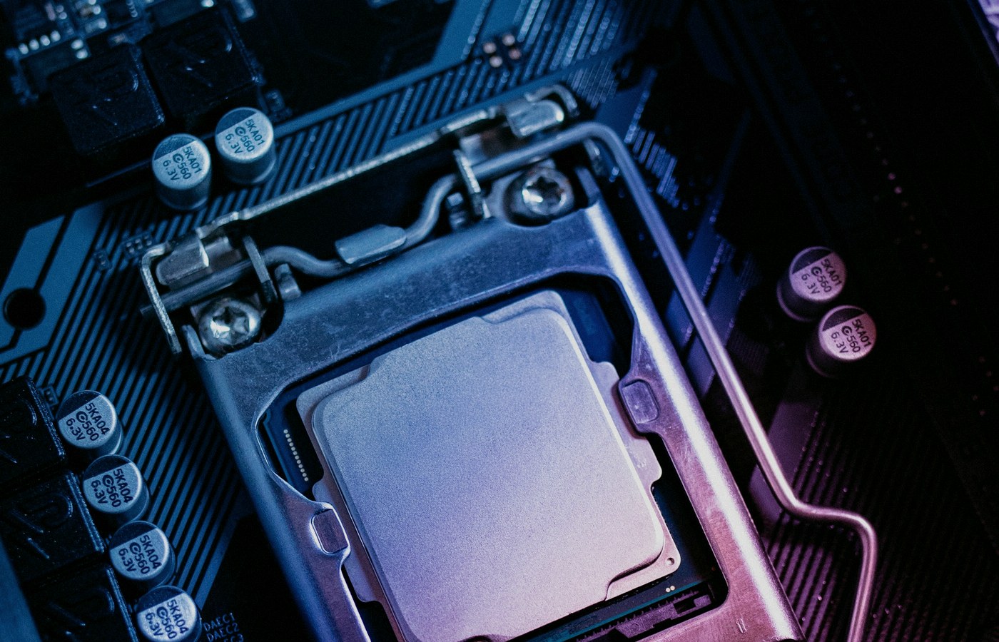 Face-free close-up of a CPU seated on a computer motherboard — related still for Jakub Pachocki An Alien Mind shared safety bars and voluntary slowdown coverage