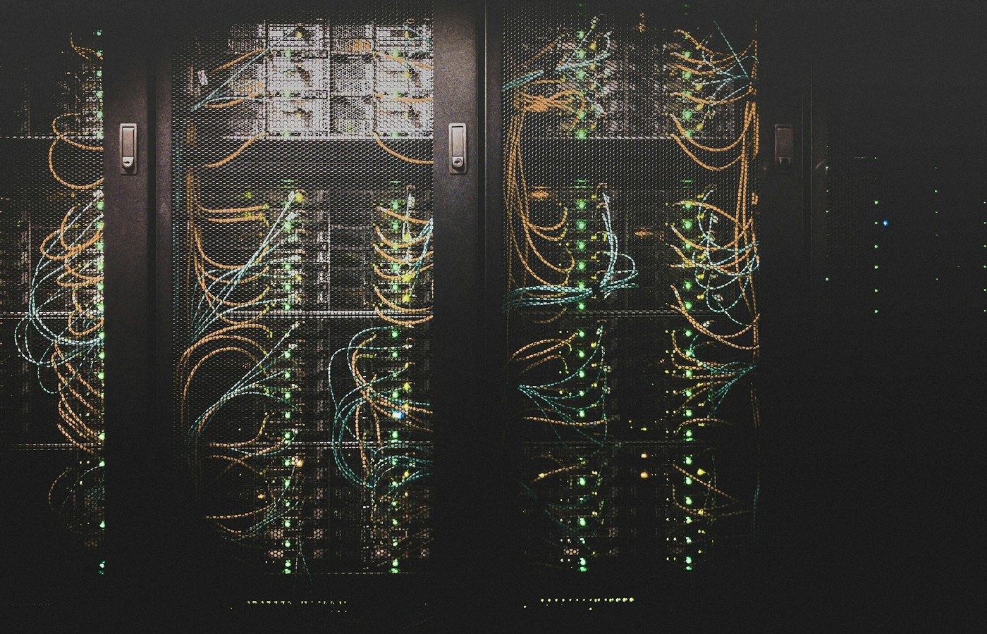 Face-free data-center network cables and server racks still — related cyber infrastructure still for OpenAI Daybreak for Frontline Defenders $1B credits coverage