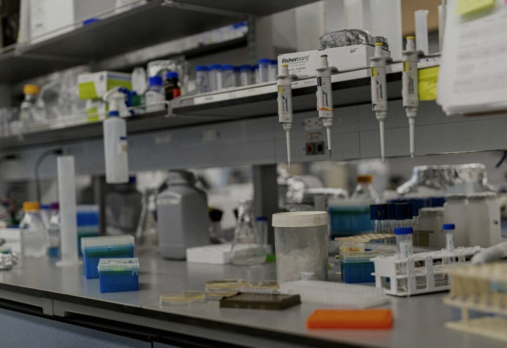 Face-free Unsplash photograph of a laboratory bench with scientific equipment — related still for OpenAI Foundation Public Data for Health grantmaking news Sep 15 2026