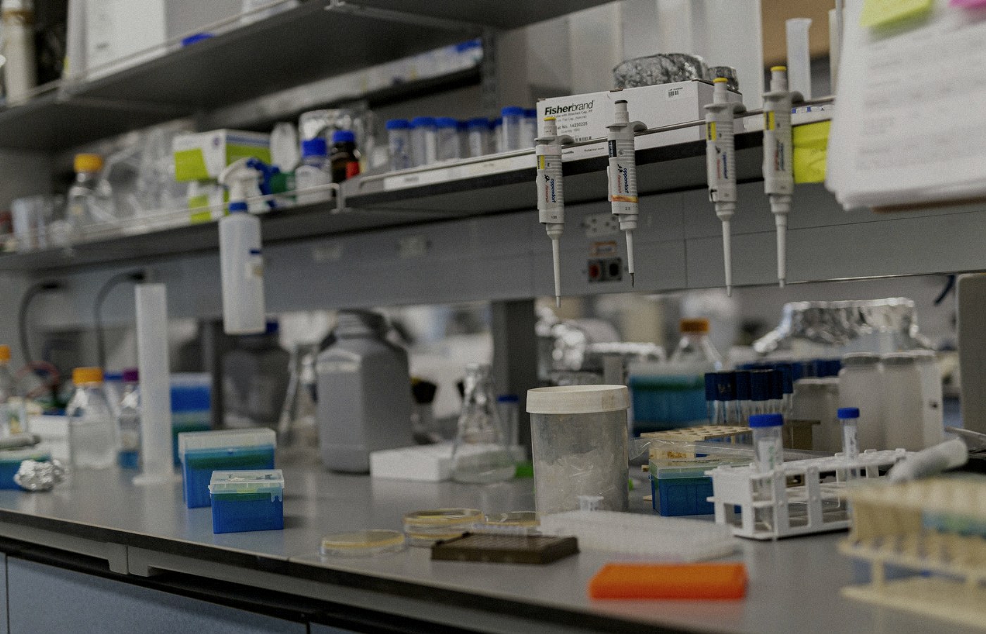Face-free Unsplash photograph of a laboratory bench with scientific equipment — related still for OpenAI Foundation Public Data for Health grantmaking news Sep 15 2026