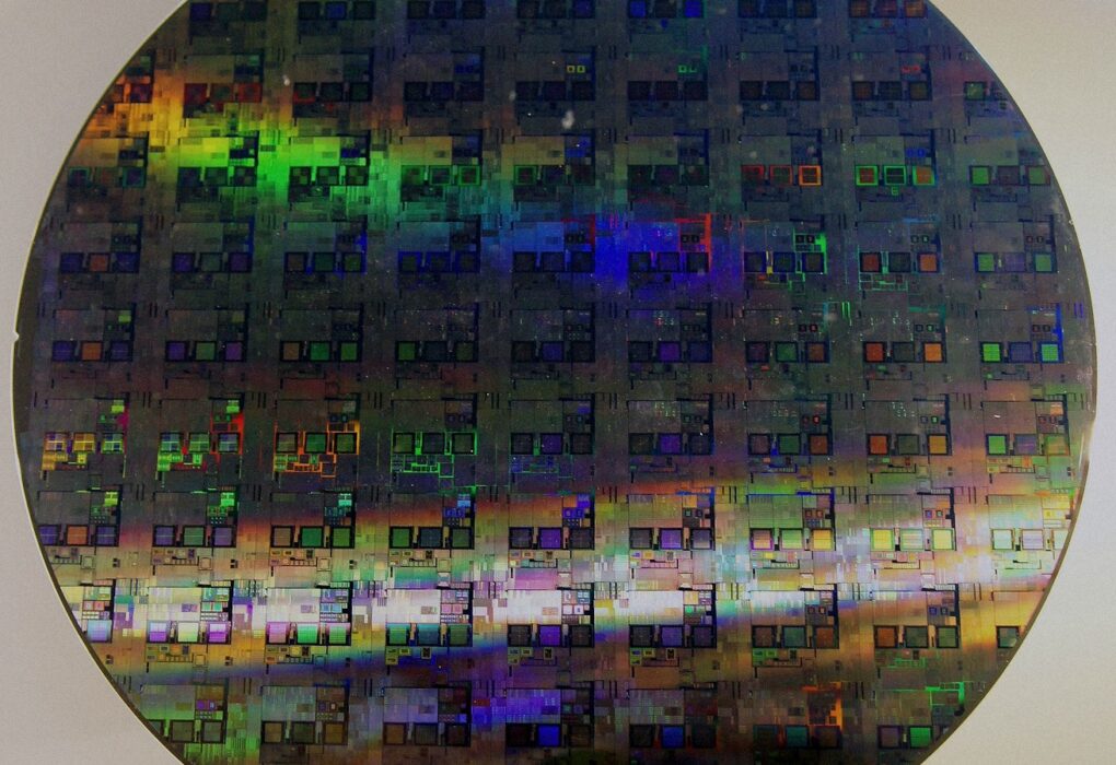 Face-free Wikimedia photograph of a 12-inch silicon wafer with die grid and iridescence — related still for Samsung co-led Euclyd Series A inference-chip funding September 2026