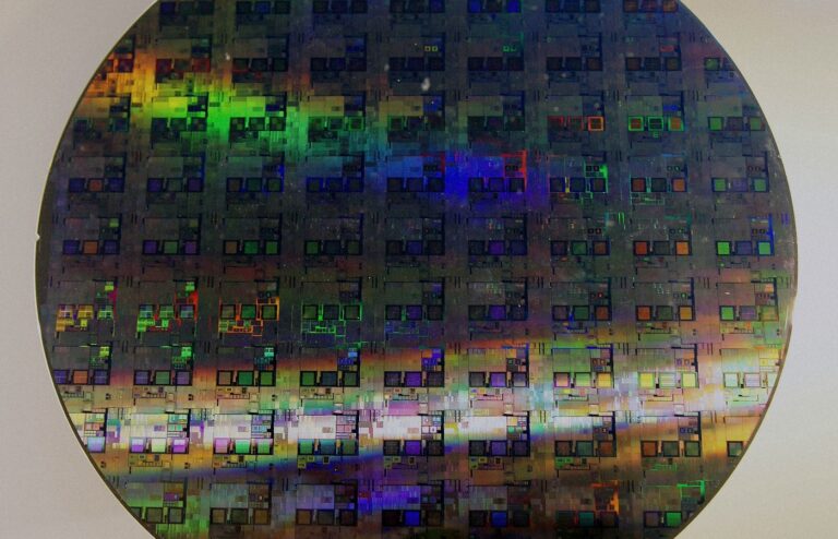 Face-free Wikimedia photograph of a 12-inch silicon wafer with die grid and iridescence — related still for Samsung co-led Euclyd Series A inference-chip funding September 2026