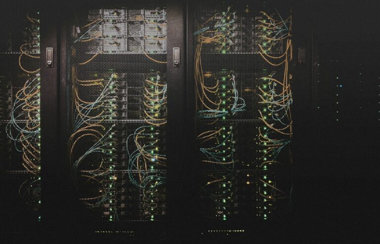 Face-free Unsplash photo of lit server racks in a data-center aisle — hero still for NVIDIA CUDA Toolkit 13.4 Windows on Arm and Rubin GPU preview September 2026