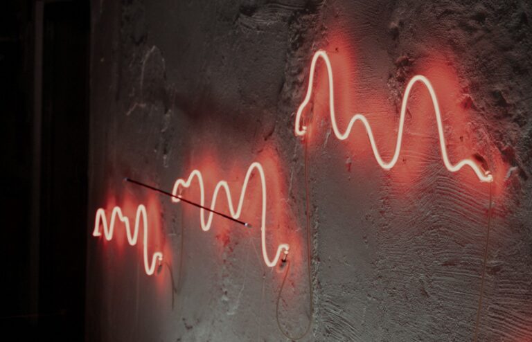 Face-free red neon sound-wave still for Treble acoustic simulation and physical AI, Sep 17 2026