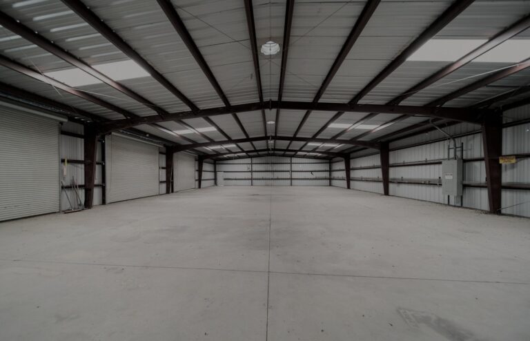 Face-free empty industrial warehouse geometry for Vantora / Silversmith physical-AI corp venture studio, Sep 20 2026