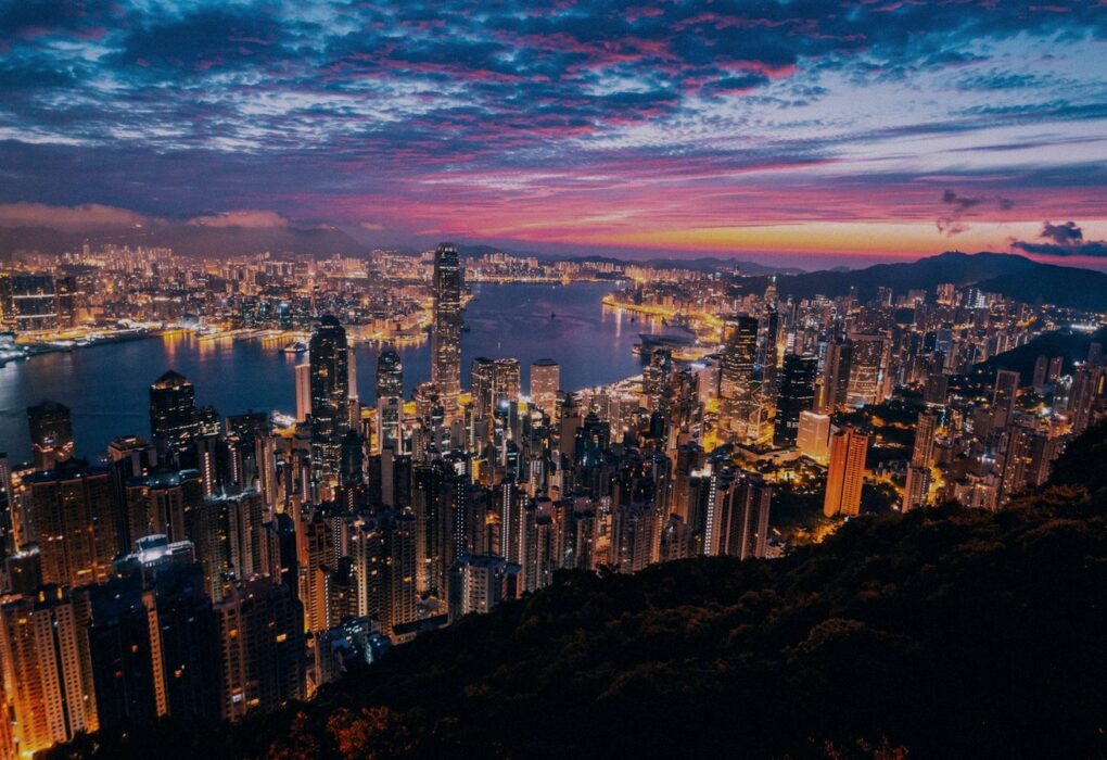 Face-free Unsplash Hong Kong skyline and Victoria Harbour twilight still — hero for Z.AI 2513.HK $5 billion Hong Kong share placement and zero-coupon convertible bond raise September 2026