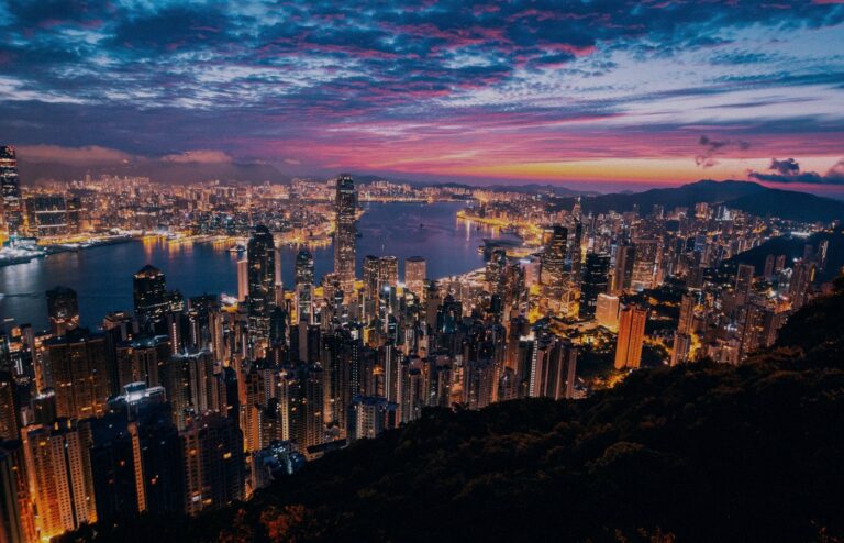 Face-free Unsplash Hong Kong skyline and Victoria Harbour twilight still — hero for Z.AI 2513.HK $5 billion Hong Kong share placement and zero-coupon convertible bond raise September 2026